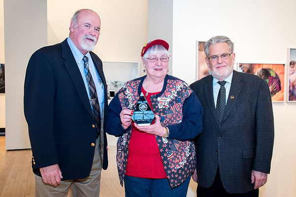 Distinguished Alumna Award Winner Susan Wells with Alumni Association member Mike Cavanaugh (left) and Sage President Chris Ames (right).