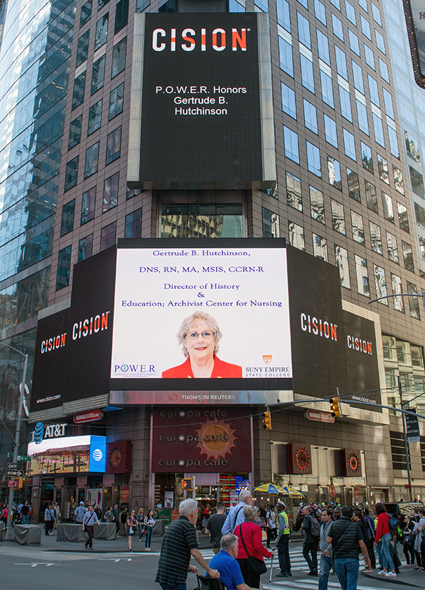 The Reuters billboard in Times Square in New York City with a tribute to Gertrude B. Hutchinson.