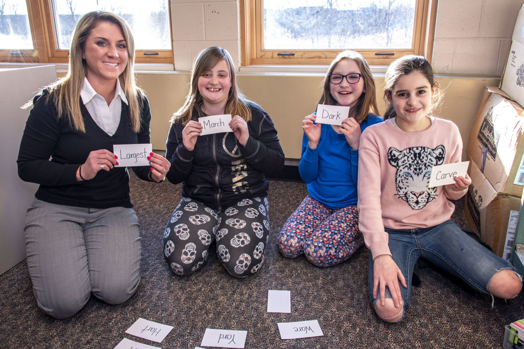 student teacher and elementary students in classroom