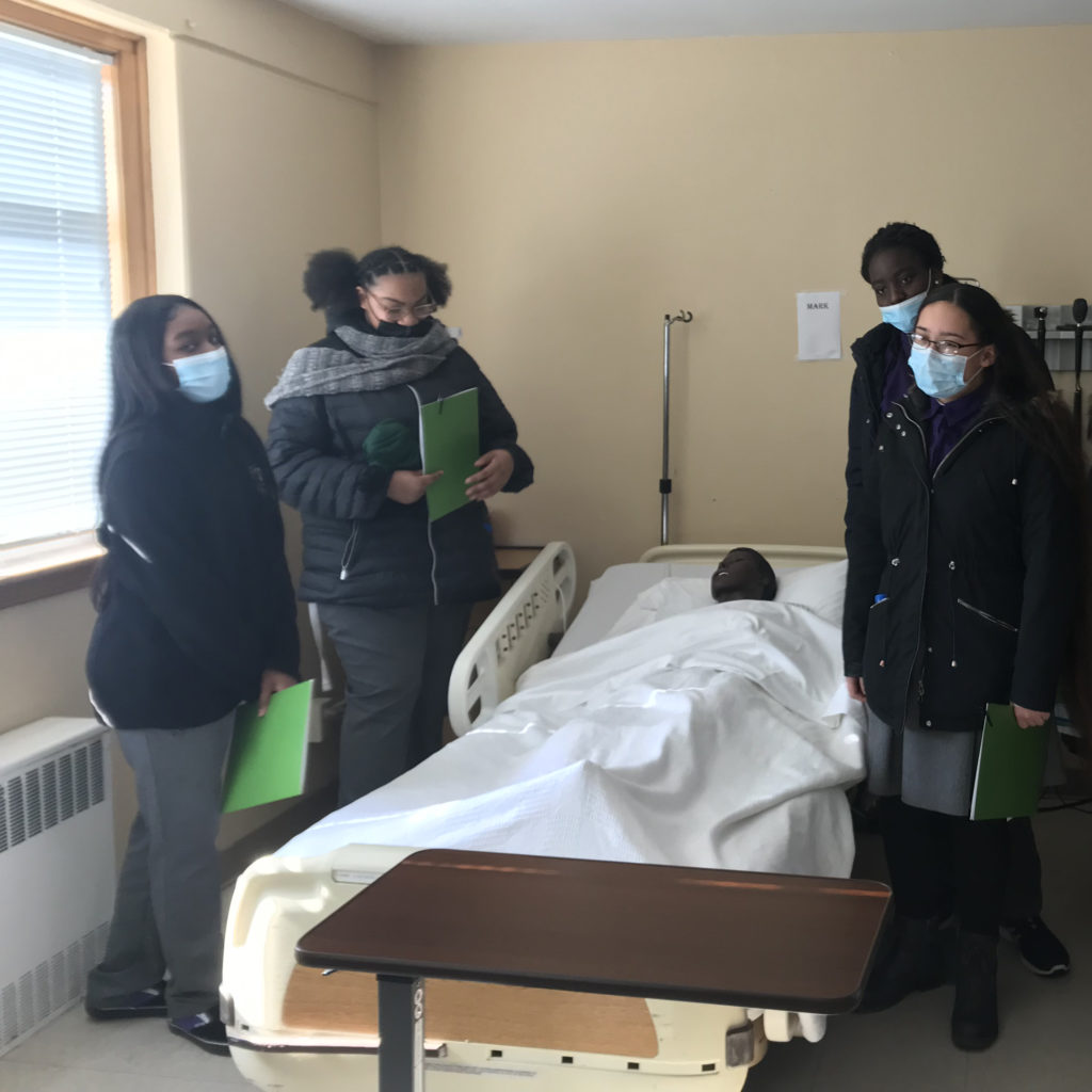 Four Students from Albany Leadership Academy in one of Sage's Nursing simulation labs