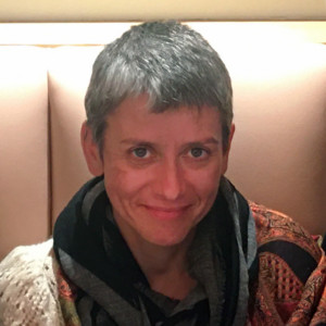 Woman sitting and smiling at the camera