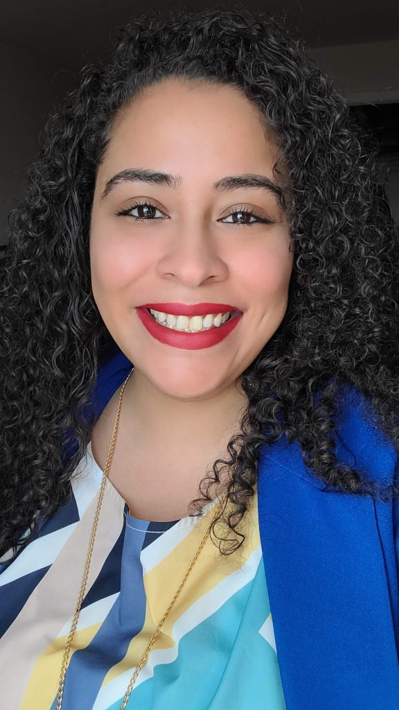 person dressed professionally smiling at camera