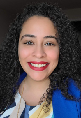person dressed professionally smiling at camera