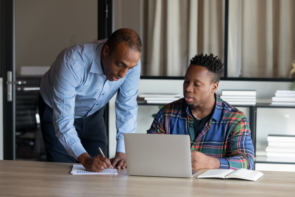 Graduate student learning with mentorship support while researching how to get a master's degree