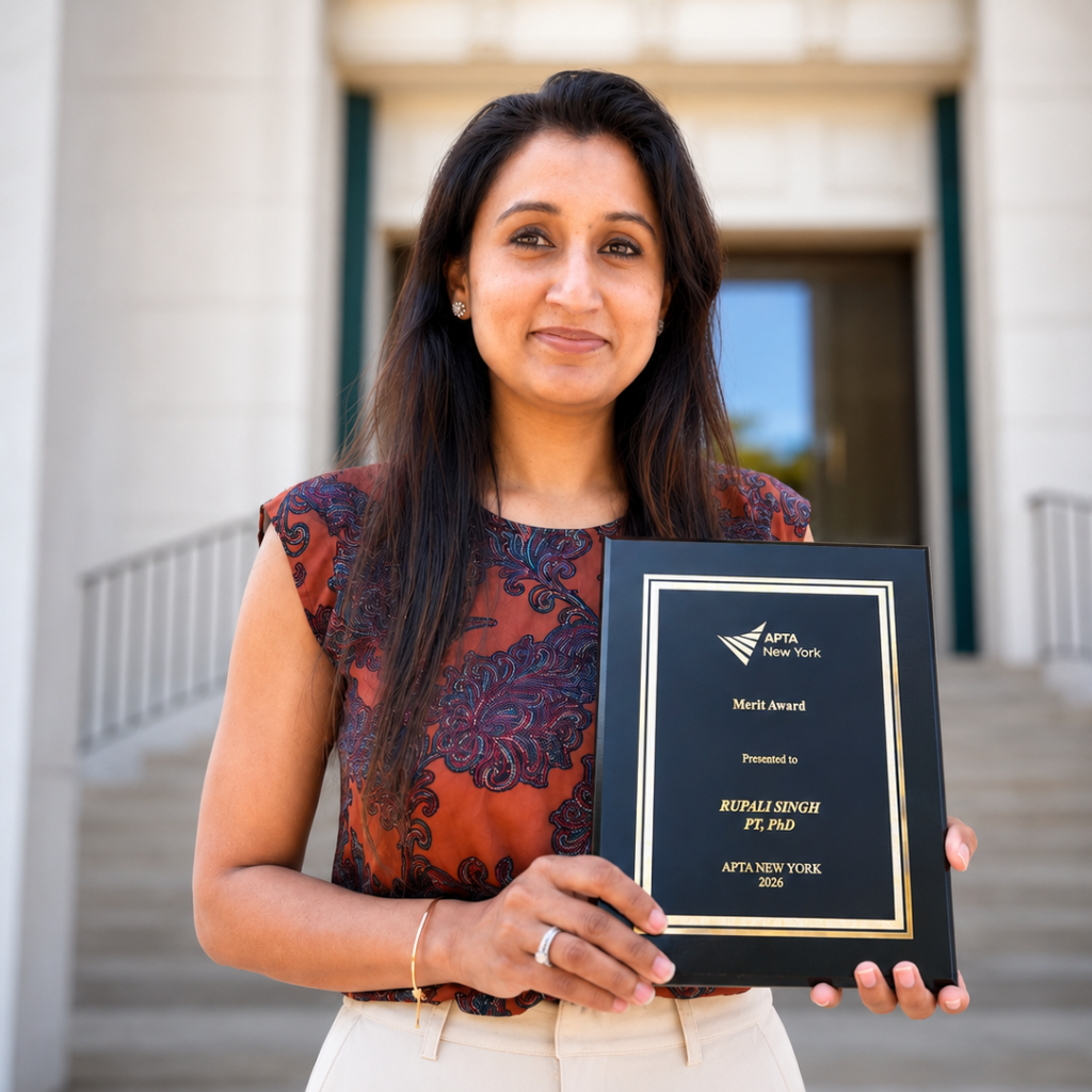 Person holding an award plaque in front of a building with columns and steps